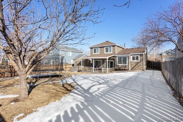 back of property with a trampoline