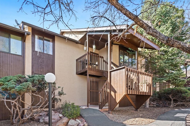 doorway to property with stucco siding