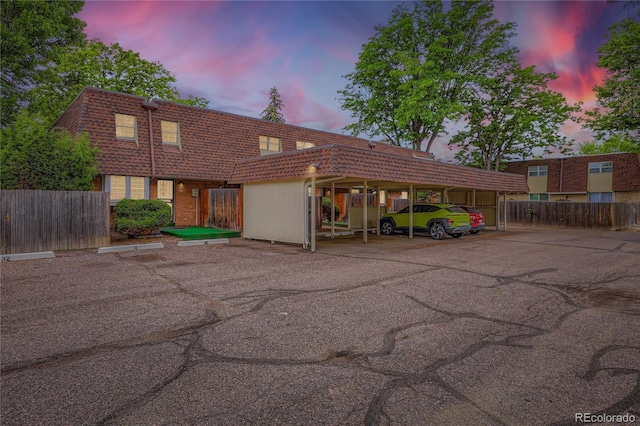 1200 S Monaco St Parkway Unit 31, Denver, CO 80224 - view of front of home with covered and uncovered parking