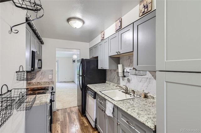 1200 S Monaco St Parkway Unit 31, Denver, CO 80224 - kitchen with white dishwasher, stainless steel range oven, gray cabinetry, and dark wood-type flooring
