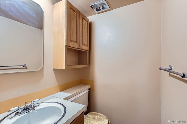 1200 S Monaco St Parkway Unit 31, Denver, CO 80224 - half bathroom featuring toilet and vanity