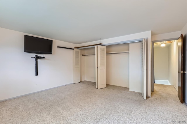 1200 S Monaco St Parkway Unit 31, Denver, CO 80224 - unfurnished bedroom featuring multiple closets and light colored carpet