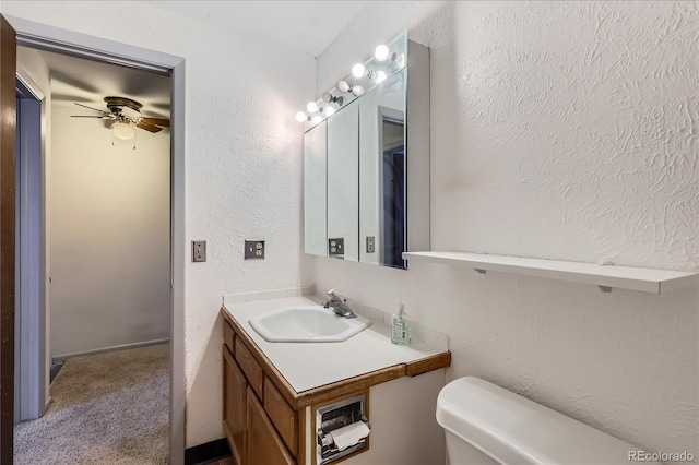 1200 S Monaco St Parkway Unit 31, Denver, CO 80224 - bathroom featuring a ceiling fan, vanity, and a textured wall