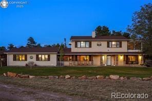 6100 Waterbarrel Rd, Beulah, CO 81023 - rear view of property featuring a yard