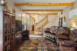 6100 Waterbarrel Rd, Beulah, CO 81023 - living room with stairway and beamed ceiling