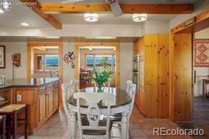 6100 Waterbarrel Rd, Beulah, CO 81023 - dining area featuring beamed ceiling and light tile patterned floors
