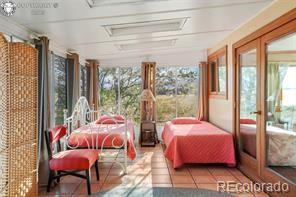 6100 Waterbarrel Rd, Beulah, CO 81023 - sunroom / solarium with french doors and tile patterned flooring