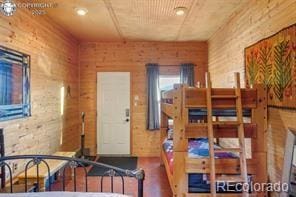 6100 Waterbarrel Rd, Beulah, CO 81023 - dining area featuring recessed lighting and wooden walls