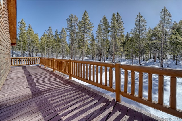 view of snow covered deck