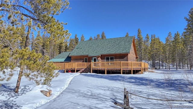 view of front of house featuring a wooden deck