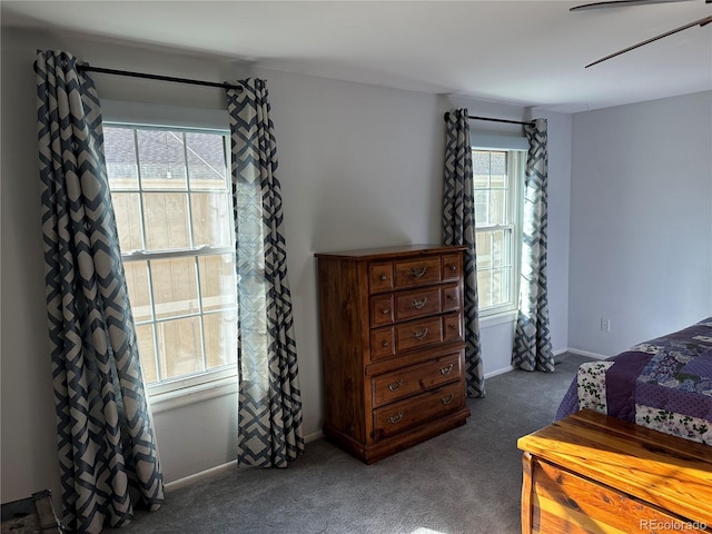 bedroom featuring dark carpet