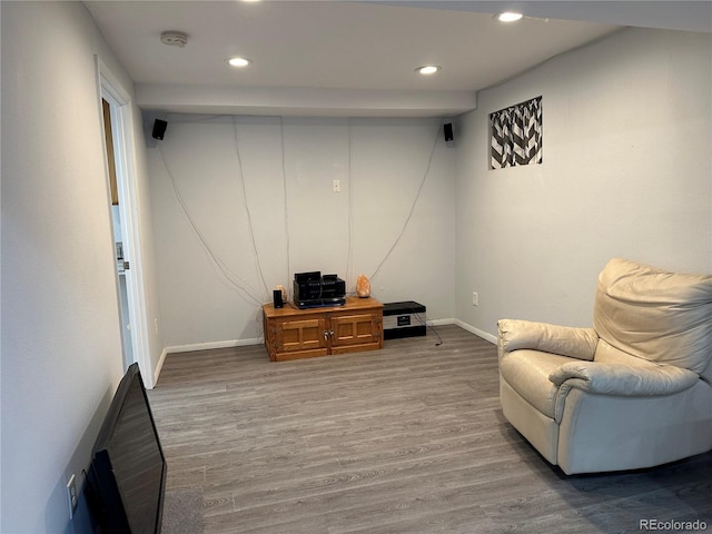 living area with hardwood / wood-style flooring