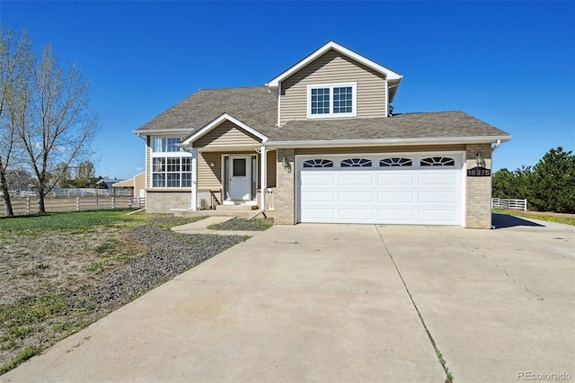 16275 Electra St, Brighton, CO 80603 - traditional home with brick siding, fence, and driveway