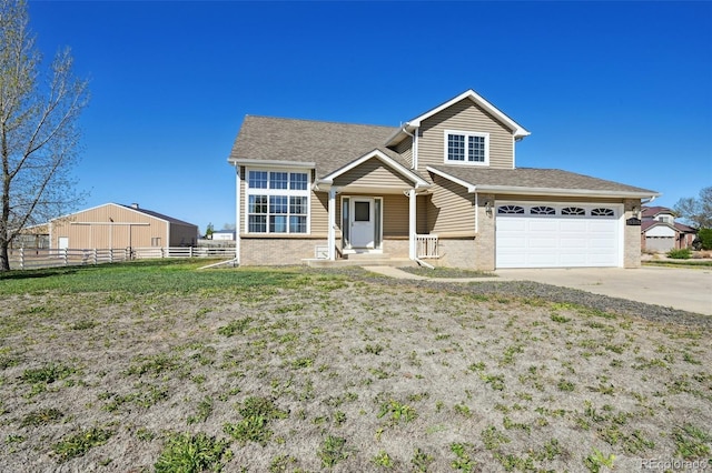 16275 Electra St, Brighton, CO 80603 - view of front of property featuring a garage, fence, brick siding, a shingled roof, and driveway