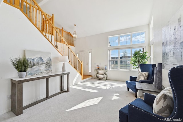 16275 Electra St, Brighton, CO 80603 - sitting room with carpet flooring, a high ceiling, and stairway