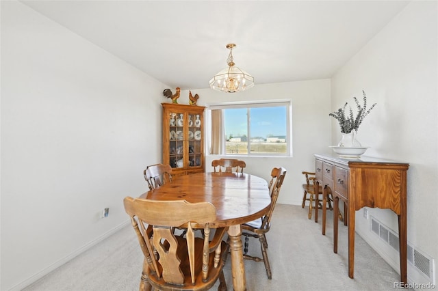16275 Electra St, Brighton, CO 80603 - dining space with baseboards, light colored carpet, and a notable chandelier