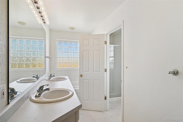 16275 Electra St, Brighton, CO 80603 - full bathroom with a sink, tile patterned floors, and a stall shower