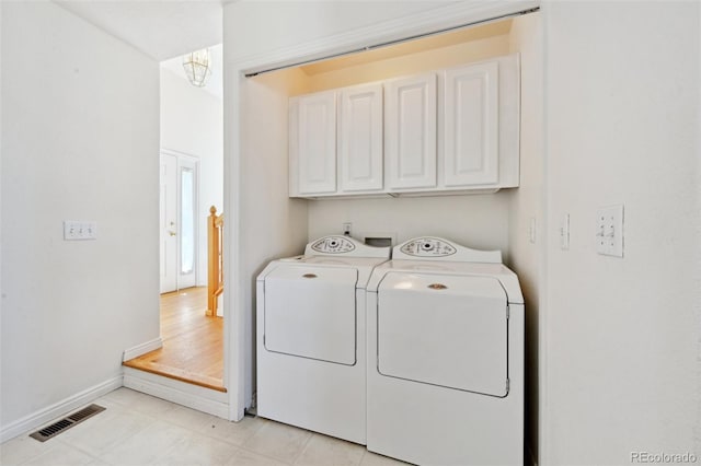 16275 Electra St, Brighton, CO 80603 - clothes washing area featuring cabinet space, a chandelier, baseboards, visible vents, and washer and clothes dryer