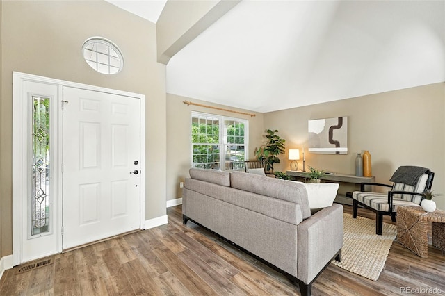 4253 Lark Sparrow St, Highlands Ranch, CO 80126 - foyer entrance featuring wood finished floors and high vaulted ceiling