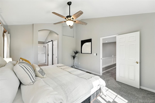 4253 Lark Sparrow St, Highlands Ranch, CO 80126 - carpeted bedroom with lofted ceiling, arched walkways, a barn door, and a ceiling fan