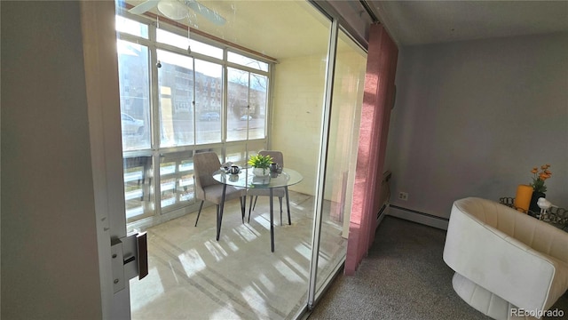 dining room with a baseboard heating unit