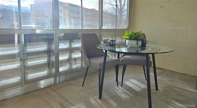 dining room with concrete flooring