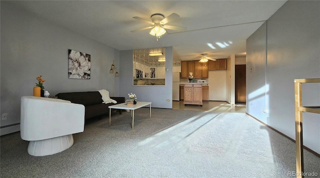 living room featuring ceiling fan and baseboard heating