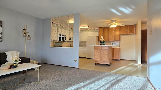 kitchen with ceiling fan, light colored carpet, and white fridge