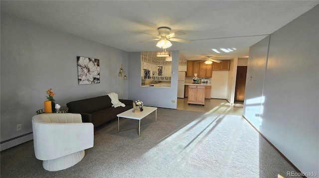 living room featuring ceiling fan and a baseboard radiator