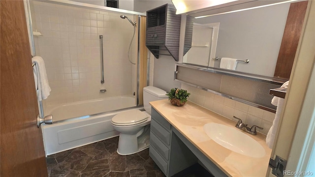 full bathroom with tasteful backsplash, enclosed tub / shower combo, vanity, and toilet