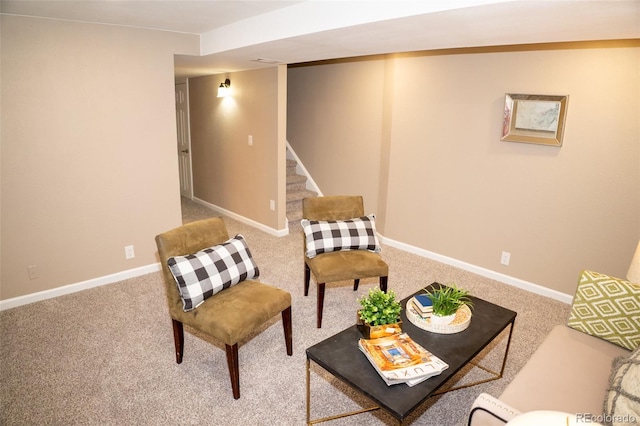 living area featuring carpet floors