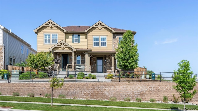 23293 E Jamison Dr, Aurora, CO 80016 - craftsman-style house featuring stone siding and a porch