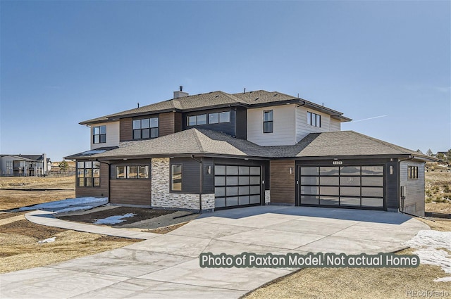 view of front of home with a chimney, an attached garage, concrete driveway, and roof with shingles