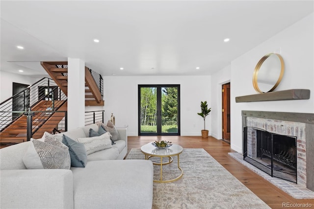 living room featuring hardwood / wood-style flooring and a fireplace