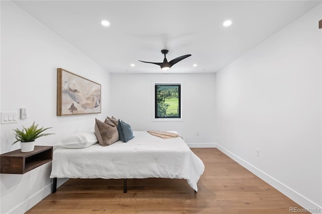 bedroom featuring ceiling fan and hardwood / wood-style flooring