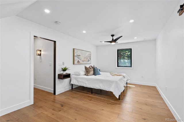 bedroom with ceiling fan and light wood-type flooring