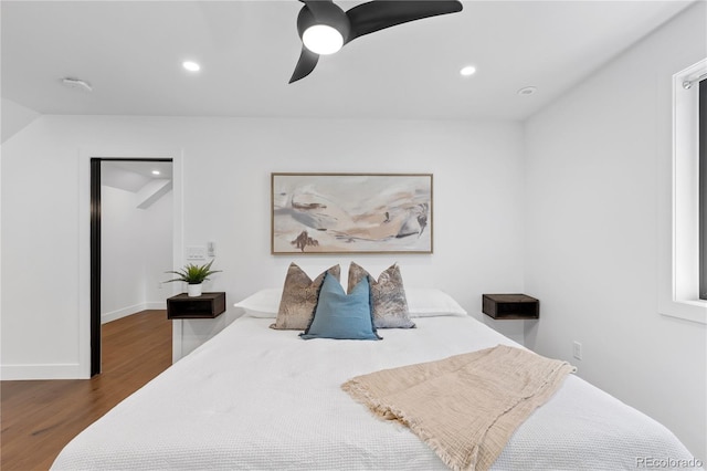 bedroom featuring ceiling fan and dark wood-type flooring