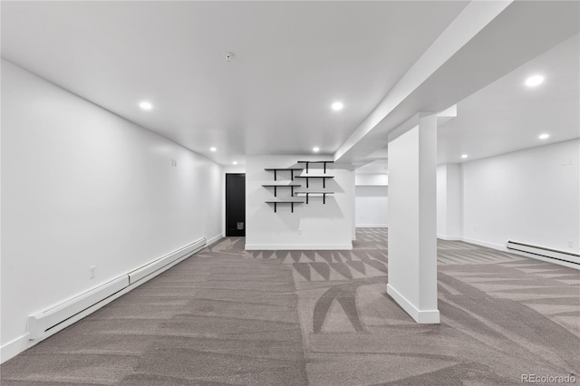 basement featuring carpet floors and baseboard heating