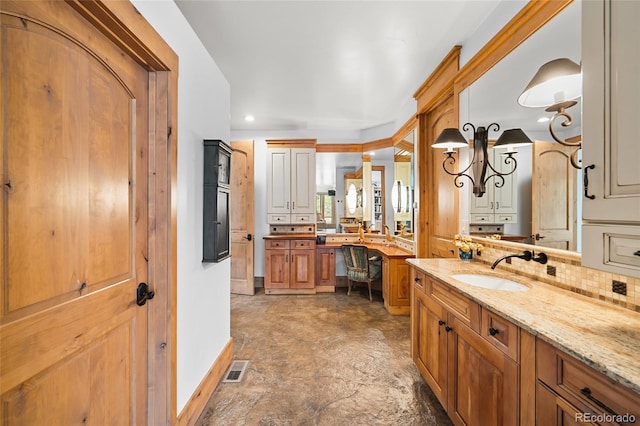 10231 Democrat Rd, Parker, CO 80134 - bathroom with vanity, backsplash, and recessed lighting