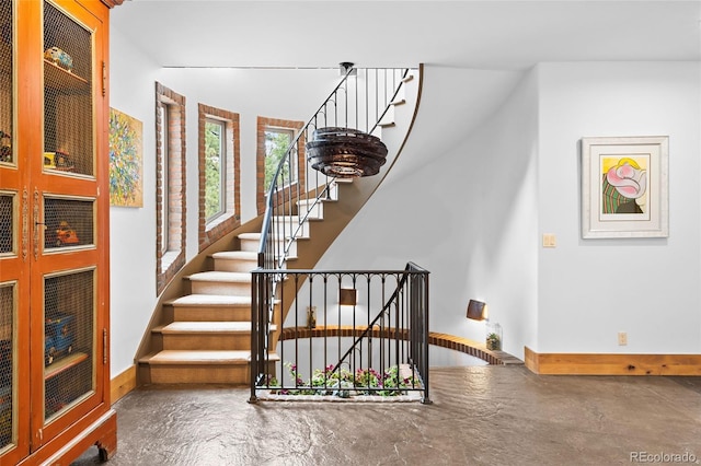 10231 Democrat Rd, Parker, CO 80134 - staircase with concrete floors and baseboards