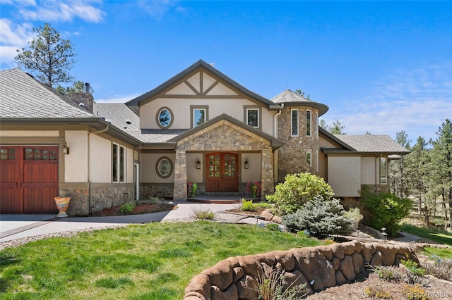 10231 Democrat Rd, Parker, CO 80134 - tudor-style house featuring stone siding, french doors, stucco siding, and a front lawn