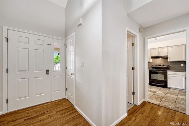 foyer entrance with light hardwood / wood-style floors