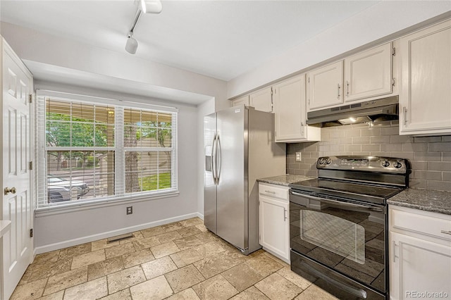 kitchen with backsplash, rail lighting, stainless steel refrigerator with ice dispenser, light tile patterned floors, and black range with electric cooktop