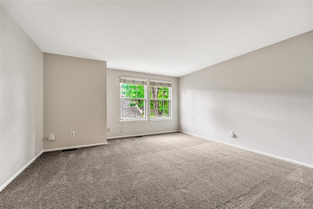 spare room featuring carpet floors