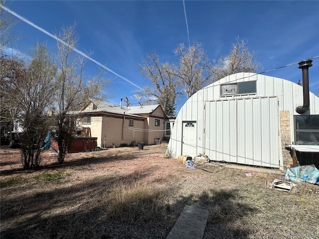 1114 La Due Ave, Alamosa, CO 81101 - view of side of property with an outdoor structure and a shed