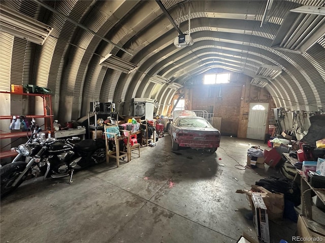 1114 La Due Ave, Alamosa, CO 81101 - misc room with vaulted ceiling, unfinished concrete floors, and a garage