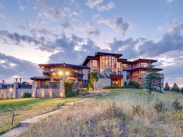 view of outdoor building at dusk