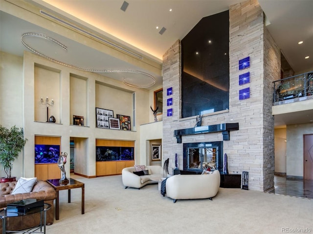 living room with high vaulted ceiling, a fireplace, and carpet floors