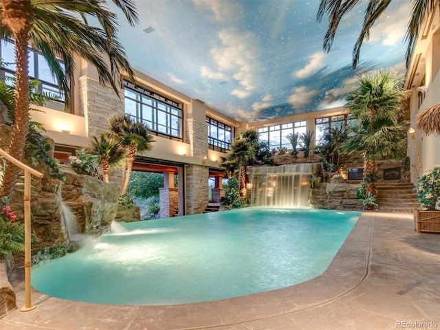 view of pool featuring pool water feature