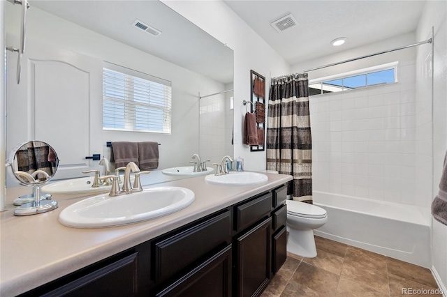 full bath featuring a sink, visible vents, and shower / bathtub combination with curtain